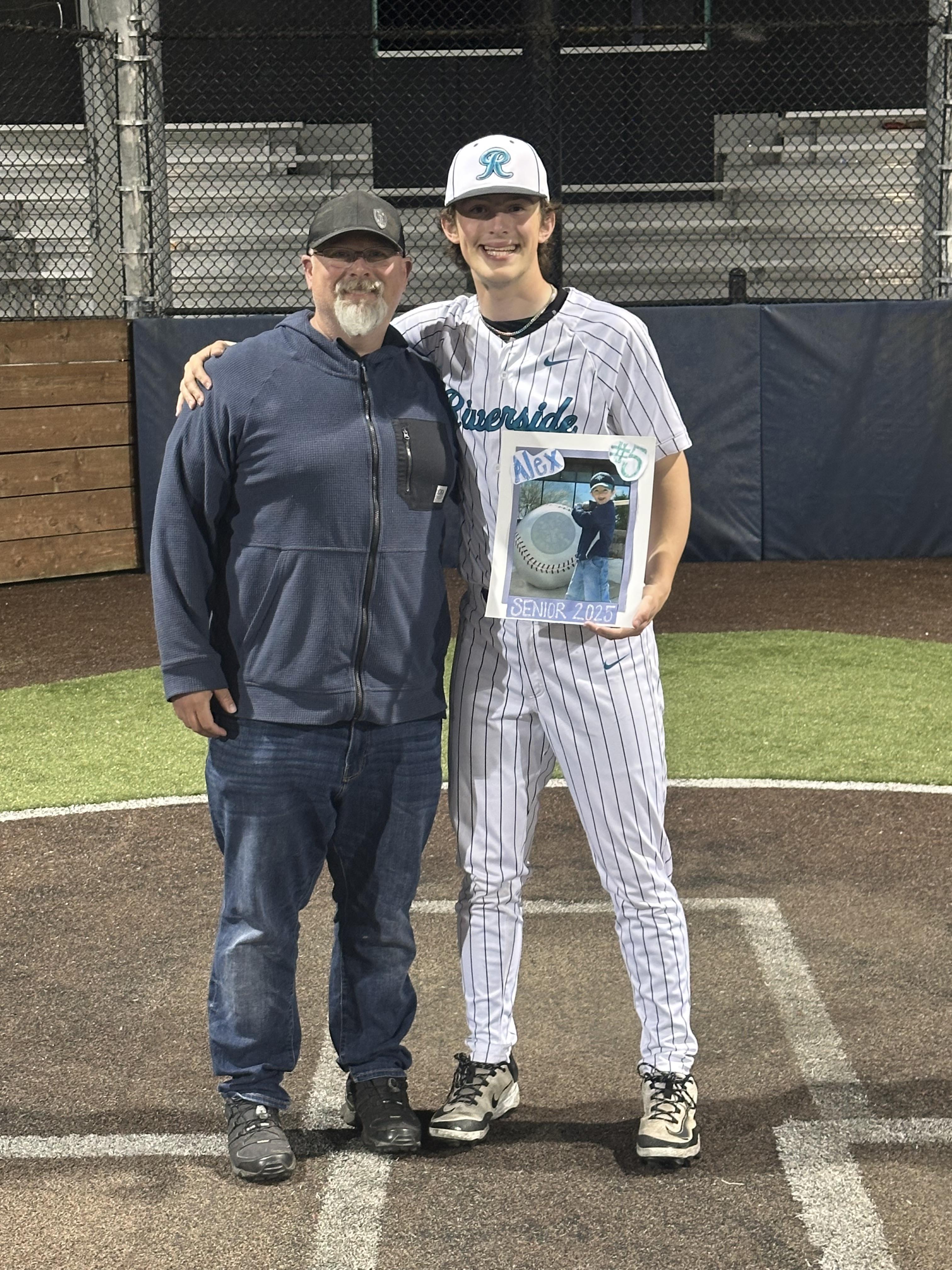 Matt Toth with his son on senior day